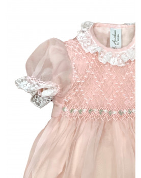 Christening silk romper with smocked bodice, pink detail.