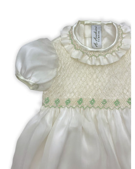 Baby silk romper with green smocked bodice