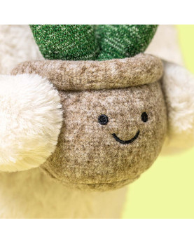 Peluche Jellycat Bashful Bunny color panna con una piccola pianta di stoffa in un vasetto marrone. Dettaglio